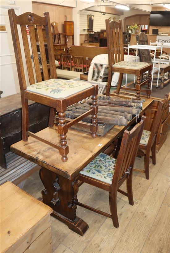 An oak refectory table and four 1920s oak dining chairs